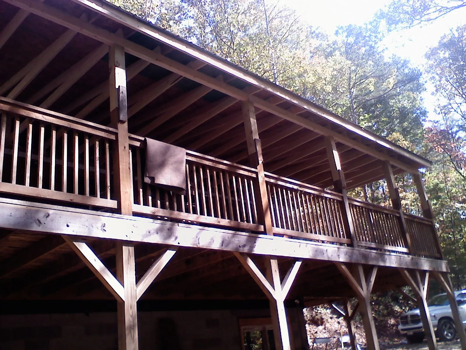 Timber framing under a new elevated porch and deck — Roof Leak Repair in Mica by Roofing Brothers